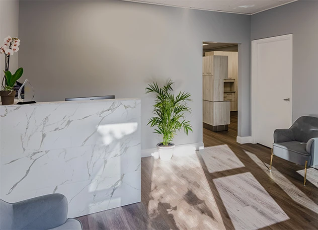 The marble reception desk and seating at MG Dental Associates